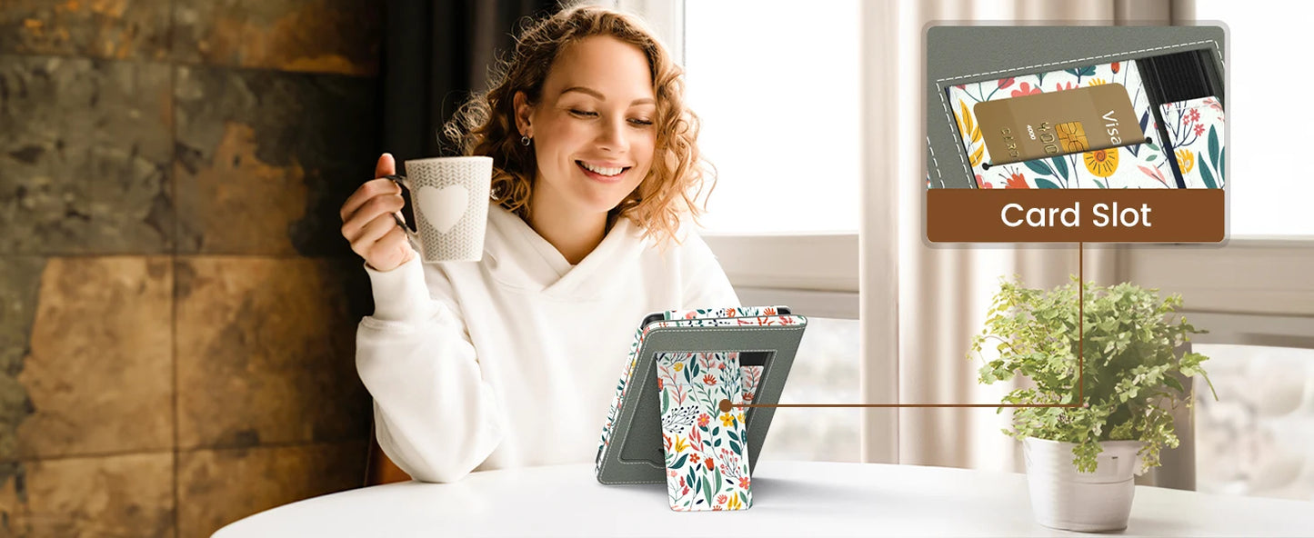 Woman holding a mug with a tablet displaying a card slot and a colorful cup on a table.