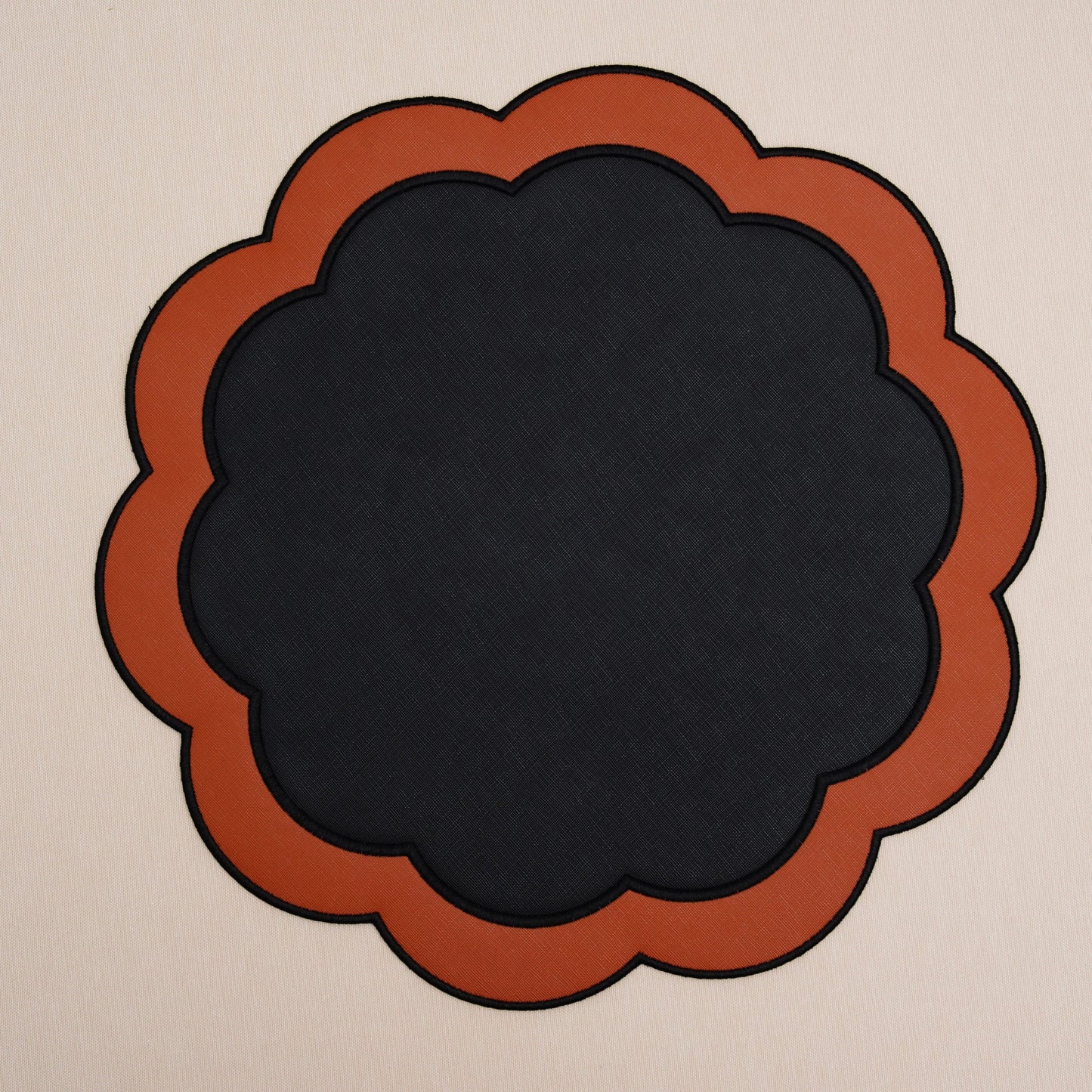 SERENITY BLACK ORANGE SCLALOPED FAUX LEATHER PLACEMAT